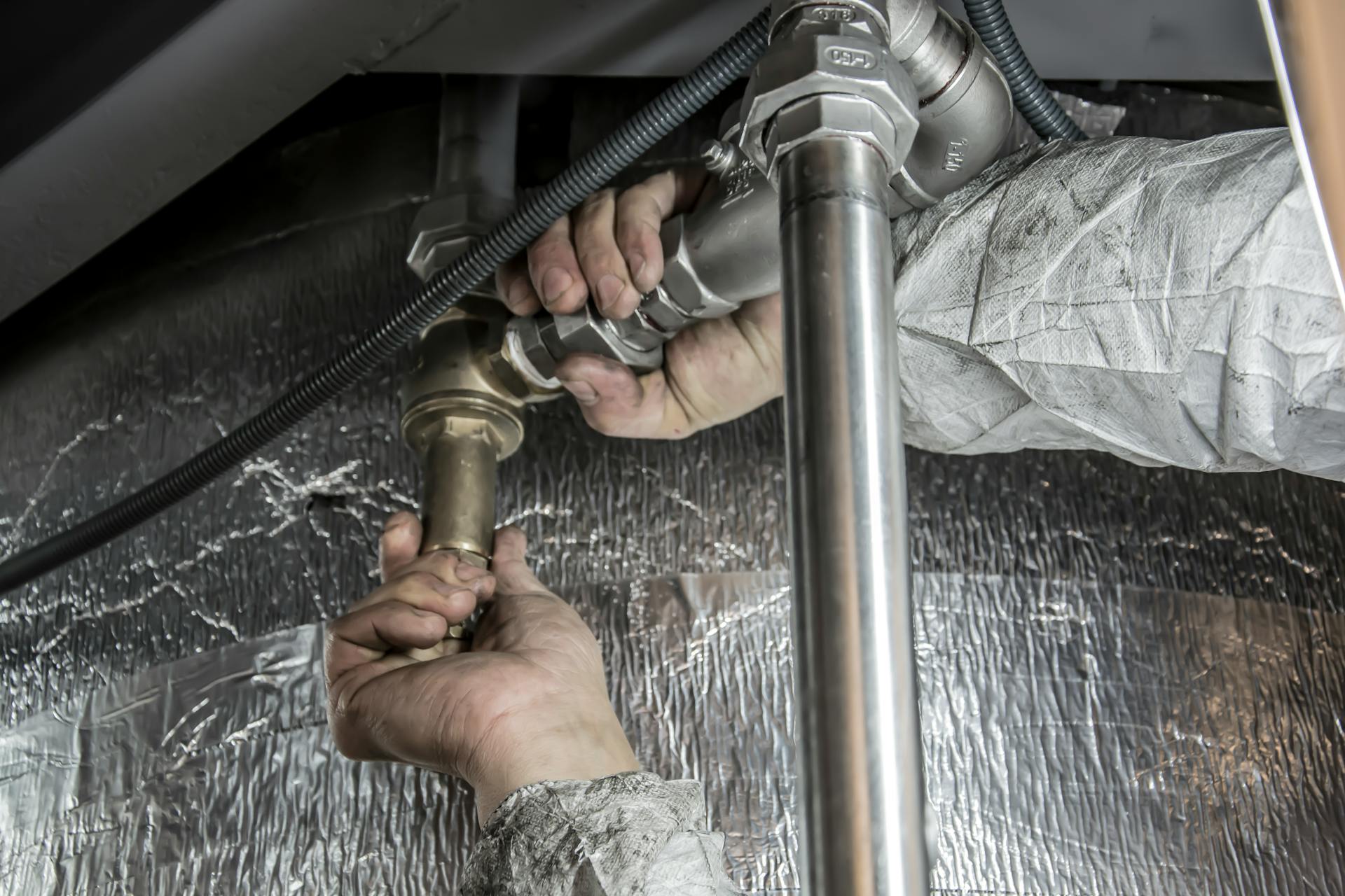 Plumbing pipework checked during a legionella risk assessment